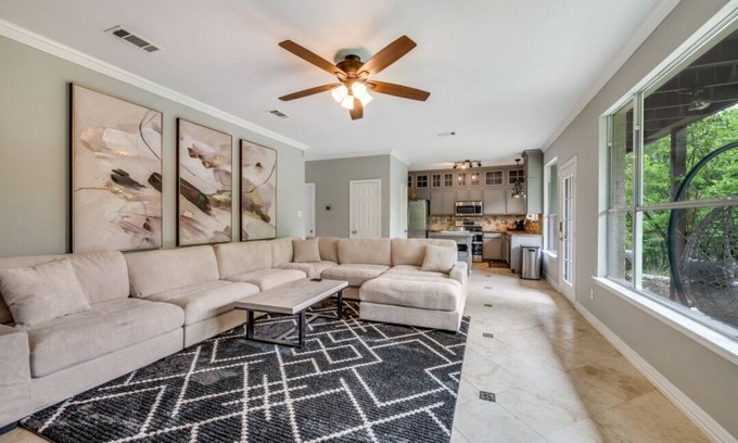 Little Elm Casa | Lakefront retreat just steps from Lake Lewisville! Enjoy 341 ft of shoreline, a private cove, sandy beach, fire pit, and pergola with built-in grill. Inside: lake views, travertine floors, cozy fireplace, and an upstairs game room with balcony.
