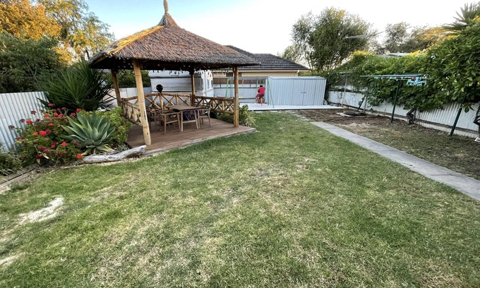 South Plympton Casa | Large backyard with outdoor seating and BBQ!