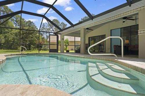 Palm Coast Casa | Large Palm Coast Pool Paradise - Family Gatherings