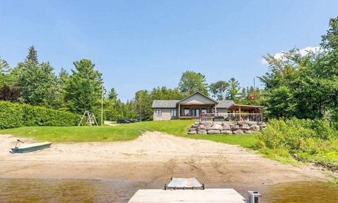 Whitewater Region Casa | Luxury Beachfront Cottage w Hot tub, Sauna & Bar