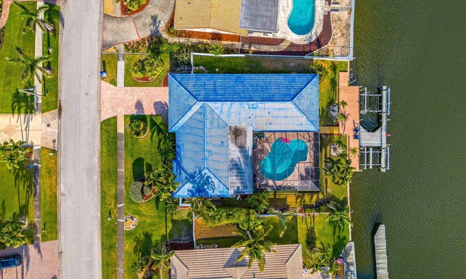 Cocoa Isles Casa | Luxury Canalfront Home w/ Heated Pool, Game Room, Boat & Jet Ski Lifts