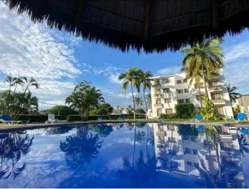 Manzanillo Apartamento | Magnifico Departamento, cocina equipada, 2 Recamaras 2 Baños , hasta 6 Personas, 3 albercas, playa a 50 mts wifi, aire acondicionado