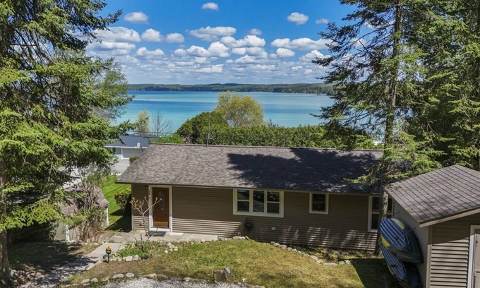 Rapid City Casa | NEW! Beautiful Torch Lake House with Beach Access