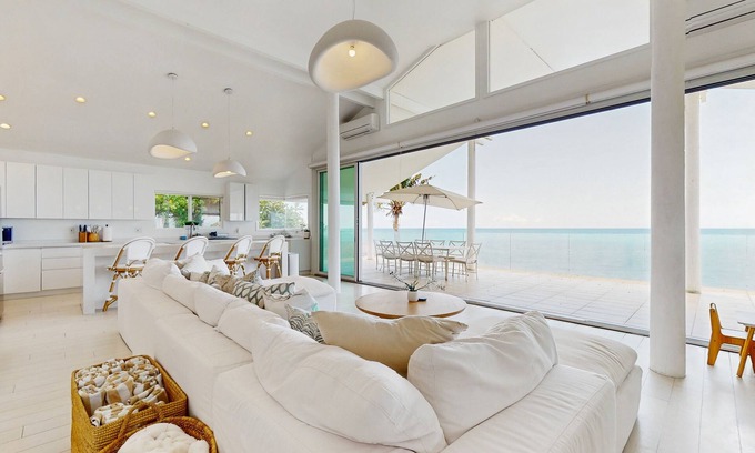 Makaha Casa | Oceanfront home with wrap around lanai, private sauna, beach access & WIFI