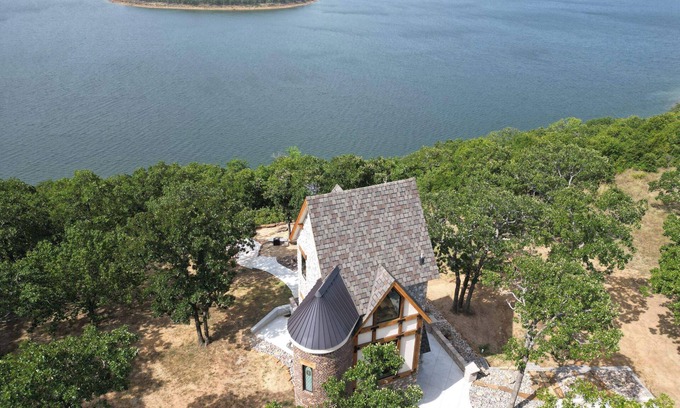 Skiatook Otro | One of a kind Castle on picturesque Skiatook Lake with a Rapunzel exterior look