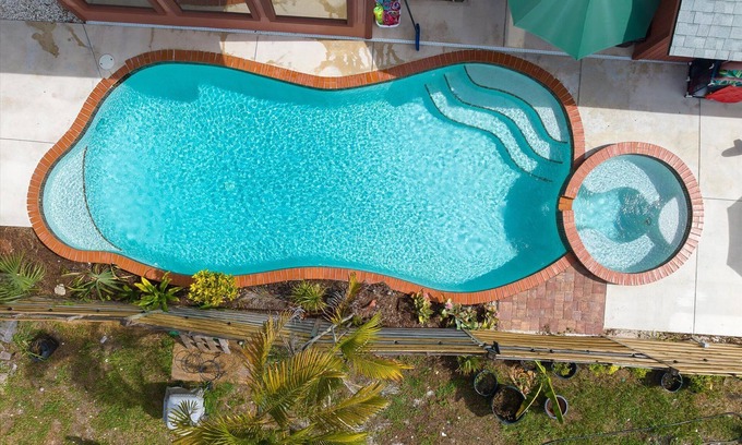 Sarasota Springs Villa | Pet Friendly Tropical Villa, Heated Salt Pool