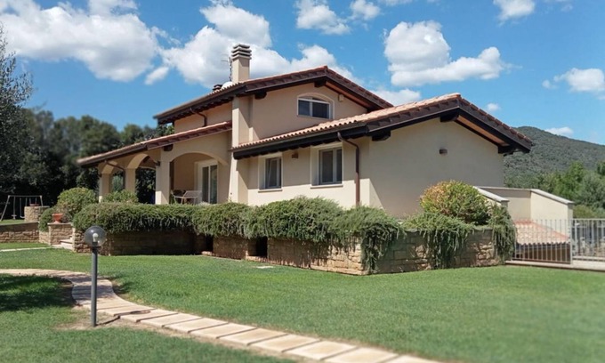 Castiglione della Pescaia Villa | Portion of villa with large garden and beautiful barbecue area 5 minutes from the sea