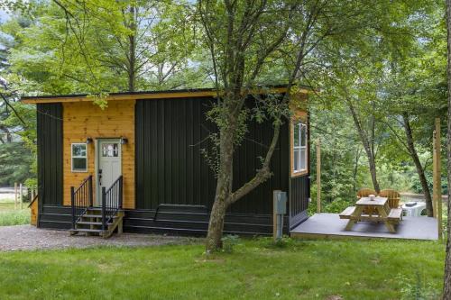 Johnson Casa | Riverside Tiny House with hot tub near Stowe