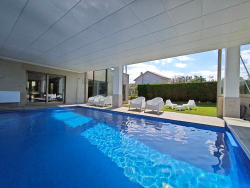 Sanxenxo Casa | Sanxenxo Casa Rial 47 con PISCINA CLIMATIZADA