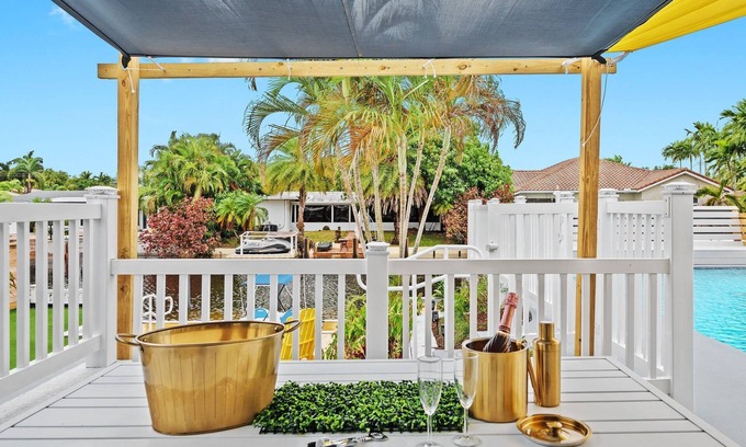 Lauderdale Isles Casa | Secluded Canal Sanctuary: Private Beach, Boat Dock, Pool, Mini-Golf Extravaganza