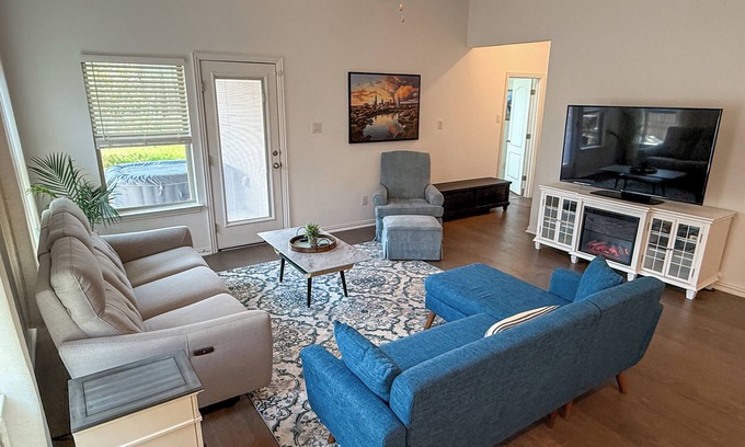 Buda Casa | Spacious 4BR Escape with Hot Tub, Laundry, and Pools in Buda.