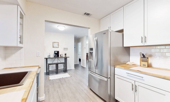 Driftwood Casa | Sunny abode in an ideal location with yard, grill, alfresco dining, open layout