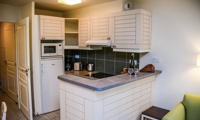 Danestal Casa | Surface area : about 50 m². Level 0 : Living room with bed-settee. Kitchen with coffee machine