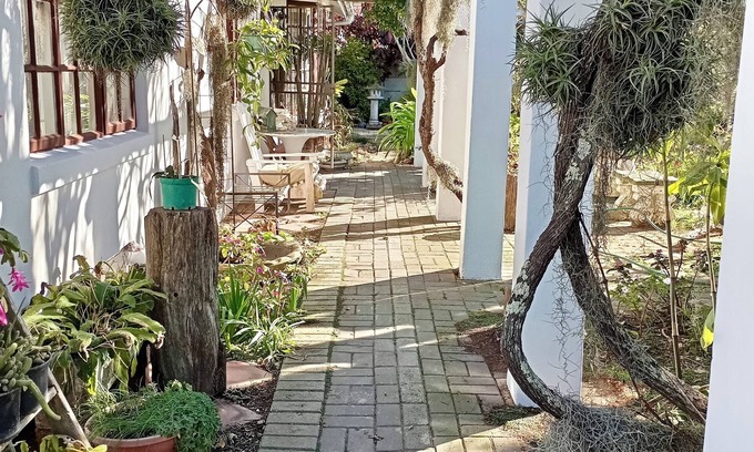Mossel Bay Casa | This cozy home is nestled in a beautiful secret garden.
