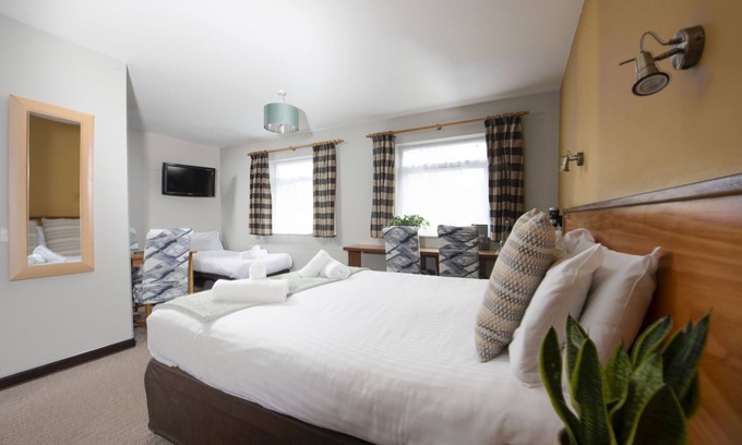 Redruth Hotel | Tolgus Family Room - 12 - A hotel room that sleeps 4 guests in 1 bedroom