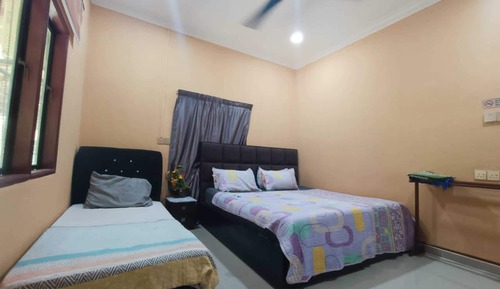 Habitación triple Deluxe, varias camas