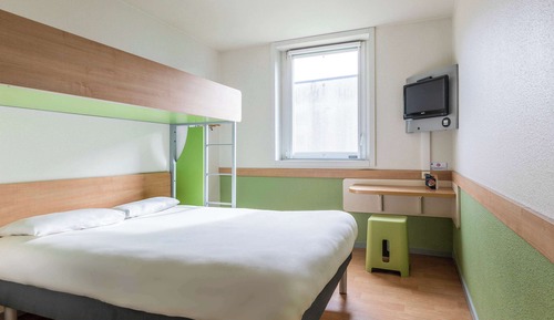Habitación triple, varias camas