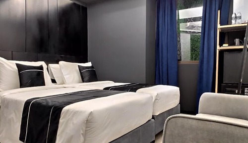 Habitación Deluxe (Buttermilk - 1 Queen/2 Single Beds)