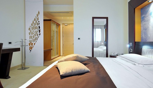 Habitación triple, varias camas