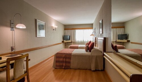 Habitación ejecutiva, varias camas