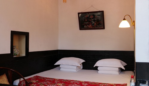 Habitación Signature doble, en la zona del patio