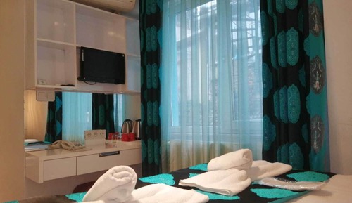 Habitación triple familiar, vistas al jardín