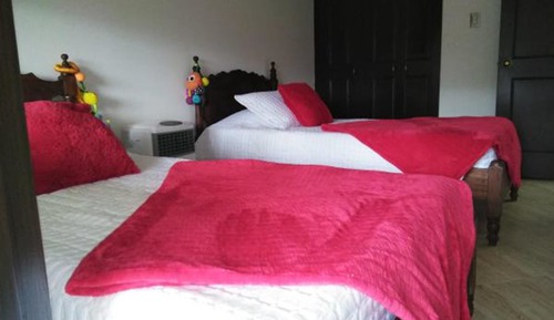 Habitación triple, varias camas