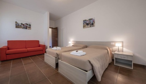 Habitación triple, varias camas