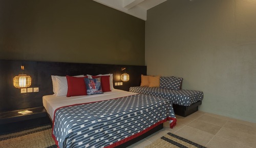 Habitación triple Deluxe, varias camas