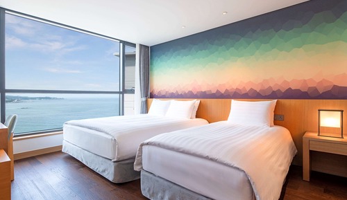 Suite superior, varias camas, vistas parciales al mar