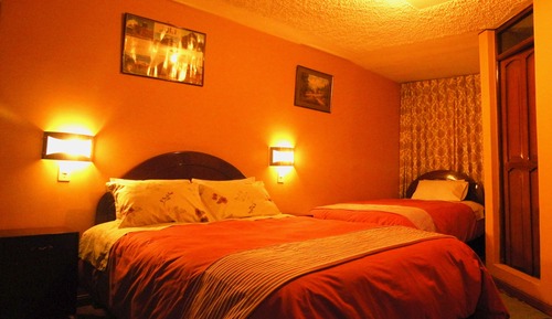 Habitación triple familiar, varias camas