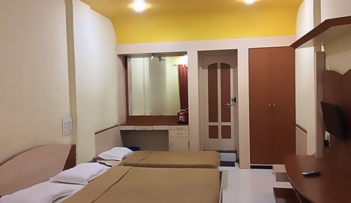 Habitación triple Deluxe, varias camas