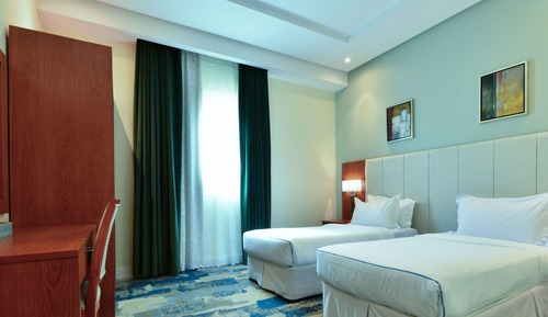 Habitación junior con 1 cama doble o 2 individuales