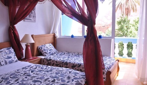 Habitación triple familiar, vistas al jardín