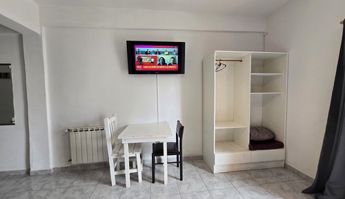 Habitación cuádruple, varias camas, balcón, vistas a la ciudad