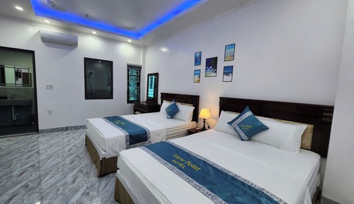 Habitación tradicional con 1 cama doble o 2 individuales, vistas parciales al mar