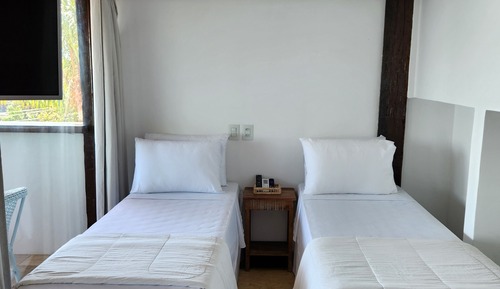 Habitación cuádruple superior, varias camas, vistas al mar