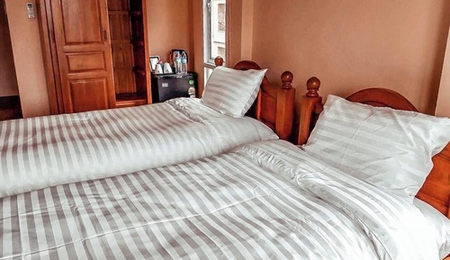 Habitación superior con 2 camas individuales