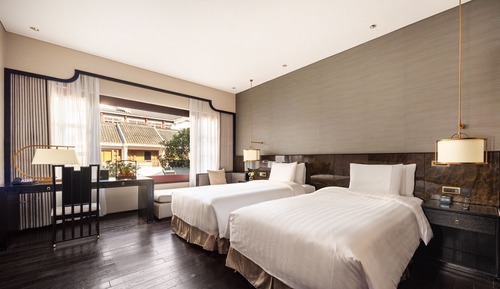 Habitación Premier con 2 camas individuales, varias camas, vistas al jardín