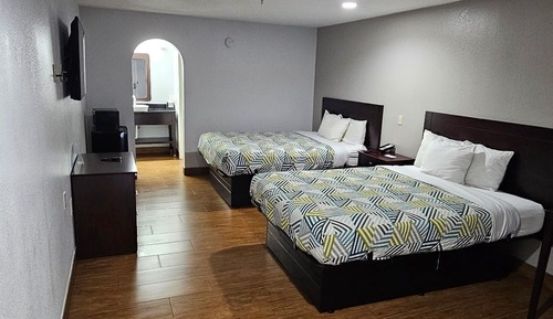 Habitación Deluxe, varias camas, fumadores, frigorífico y microondas