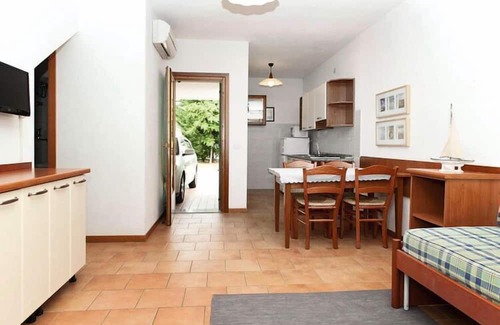Bibione Lido del Sole Apartamento | Terraced house in the Ca' del Pino holiday complex with communal pool in Bibione