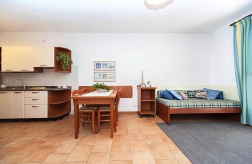 Bibione Lido del Sole Apartamento | Terraced house in the Ca' del Pino holiday complex with communal pool in Bibione