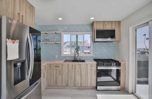 Huntington Harbour Cabaña | STEPS TO PRIVATE BEACH FRONT PANORAMIC OCEAN VIEWS! Home - parking lot - sand.