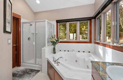 Sandpoint Casa | Waterfront home with private dock, beach, hot tub & wrap-around deck