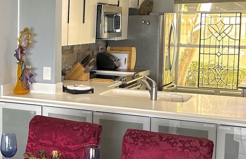 Casa del Mar Condominio | Waterfront condo with bay view, pool, patio, & W/D - calendar month rental