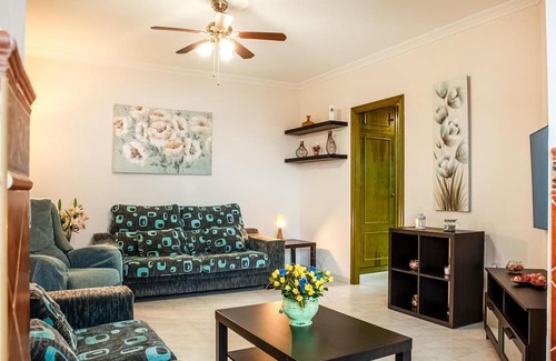 El Portil Apartamento | Enjoy a relaxing vacation in this inviting vacation home with a community pool.