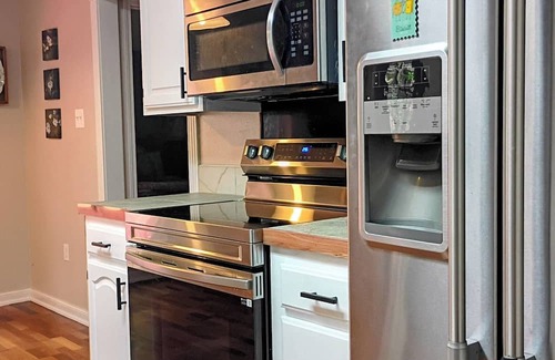 Russellville Casa | Enjoy the tranquil forest that surrounds this charming home in Dardanelle