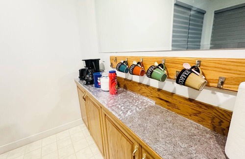 Chestermere Casa | Delightful ground level basement with AC in charming Chestermere