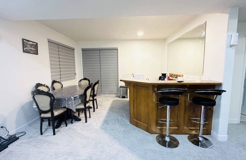 Chestermere Casa | Delightful ground level basement with AC in charming Chestermere