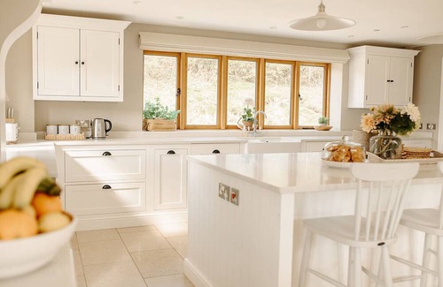 Acrefair Casa | A luxurious riverside cottage with stunning views, a hot tub, and fishing access.